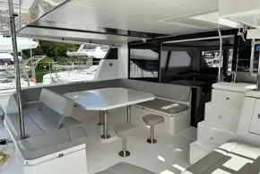 Spacious Leopard 50 yacht interior with modern seating and dining area, 2021 model.