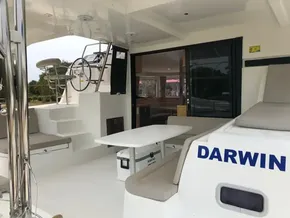 Lagoon 42 catamaran 2020 model, spacious deck with seating and steering wheel.
