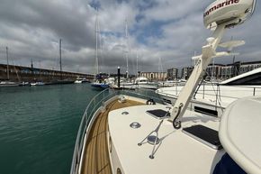 2005 Stevens 1200 Vlet yacht docked in a marina with other boats.