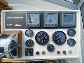 Upper helm - Raymarine speed, compass & depth instruments; P & S engines temp, oil pressure, RPM, start-stop; rudder indicator, horn & bow thruster