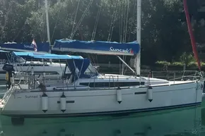 2018 Jeanneau Sun Odyssey 389 sailboat docked in a serene marina setting.
