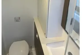 Compact bathroom in 2022 Leopard 42 yacht with modern fixtures and sleek design.