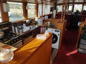 Upper deck dining/living/ galley/ bar.
