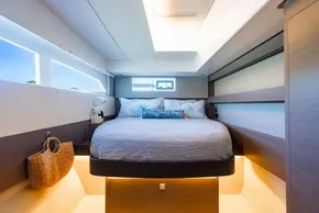 Luxurious bedroom interior of 2022 Leopard 50 yacht with modern design and ambient lighting.