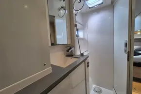 Modern bathroom interior on a 2020 Leopard 45 yacht, featuring sleek fixtures and ample lighting.
