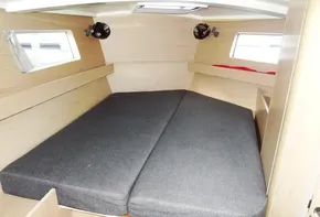 2017 Beneteau Oceanis 41 cabin with double bed and porthole windows.