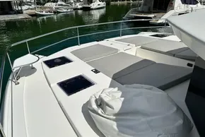 2022 Leopard 53 Powercat yacht with spacious deck and sunbathing area in marina.