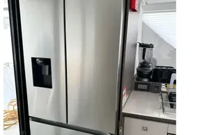 Stainless steel refrigerator in the 2025 Leopard 46 Powercat kitchen area.