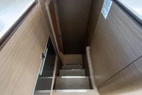 Staircase in 2025 Leopard 46 yacht with modern wood paneling.