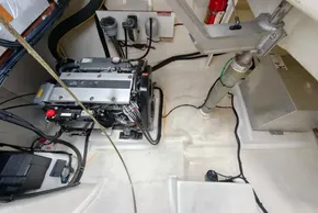 Engine room of a 2020 Leopard 50 yacht, featuring mechanical components and fire extinguisher.