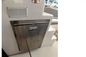 Stainless steel appliance on 2022 Leopard 45 yacht, near steps and seating area.