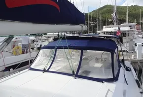 Beneteau Oceanis 46.1 2020 sailboat docked at marina with blue canopy.
