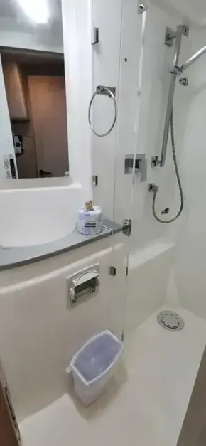 2019 Leopard 51 Powercat bathroom with shower, sink, and mirror.