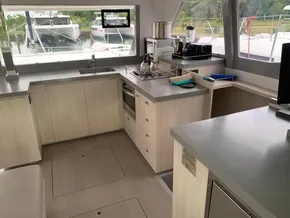 Modern kitchen interior of 2021 Leopard 45 yacht with appliances and ample counter space.