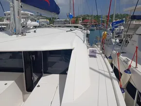 2021 Leopard 40 catamaran docked in a marina, surrounded by other boats.