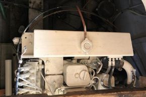 Engine compartment of a 1989 Princess 35 Flybridge boat, showing mechanical components.