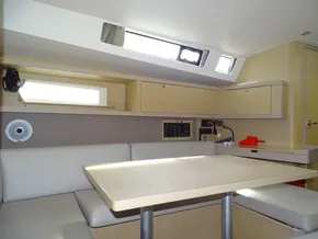 Interior of 2017 Beneteau Oceanis 45 yacht with modern seating and table.