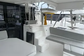 Modern 2022 Leopard 45 yacht interior with seating, steering wheel, and sleek design.