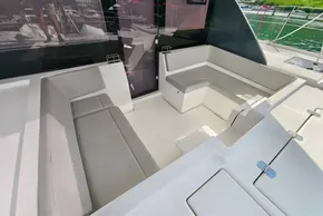 Spacious seating area on a 2021 Leopard 50 yacht, featuring modern design and comfortable cushions.