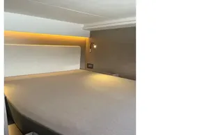 Luxurious bedroom interior of 2025 Leopard 46 yacht with modern lighting and sleek design.