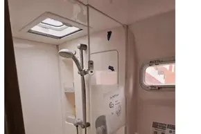 Bathroom interior of a 2008 Leopard 38 yacht, featuring a shower and sink.