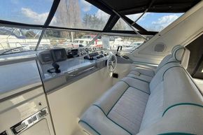 Interior cockpit of 1991 Sealine 290 Ambassador boat with steering and navigation equipment.