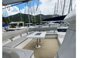 Luxurious Leopard 50 yacht deck with seating and table, 2019 model, docked at marina.