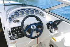 Crownline Cruiser 315 SCR - The impressive cockpit features full instrumentation with lifetime warranty. Show with optional color-matched dash and racing wheel with color-matched insert.