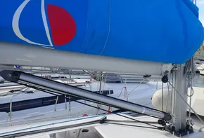Jeanneau Sun Odyssey 440 sailboat, 2019 model, with blue sail cover in marina.