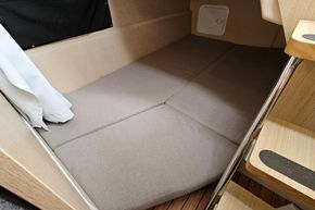 Cozy interior cabin of 2023 Balt 818 Titanium boat with cushioned seating.