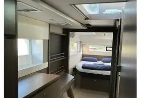Interior of 2022 Leopard 42 yacht, featuring a modern bedroom with natural light.