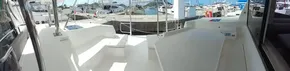 Leopard 45 catamaran deck, 2019 model, docked at marina with clear skies.
