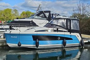 2023 Balt 818 Titanium boat docked, featuring a sleek blue and white design.