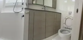 Modern bathroom in a 2020 Leopard 50 yacht with toilet, sink, and shower.