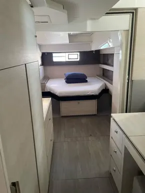 Interior of a 2020 Leopard 50 yacht cabin with bed and storage.