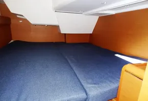 2017 Jeanneau Sun Odyssey 389 cabin with blue bedding.