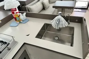 Modern kitchen sink area on 2025 Leopard 46 Powercat yacht, featuring sleek design and amenities.