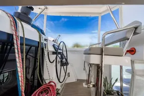 Helm of 2022 Leopard 50 yacht with ropes and steering wheel.