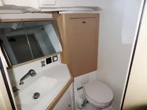 Modern bathroom in 2020 Beneteau Oceanis 46.1 yacht with sink and toilet.
