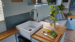 kitchen with sink and compact fridge