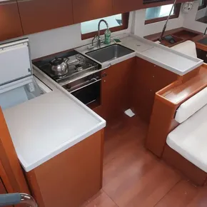 Interior of 2018 Beneteau Oceanis 51.1 yacht kitchen with modern amenities.