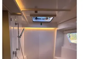 Modern shower area in 2022 Leopard 42 yacht with sleek design and natural lighting.