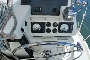 Control panel of a 2018 Leopard 45 yacht with steering wheel and gauges.