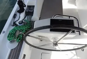 Beneteau Oceanis 46.1 2020 yacht helm station with steering wheel and green ropes.