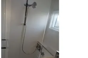 Modern bathroom in 2020 Lagoon 46 yacht with shower and window.