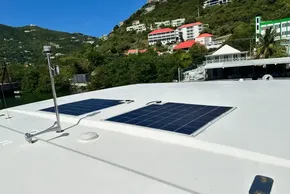 Solar panels on 2022 Leopard 53 Powercat yacht roof, scenic hillside background.
