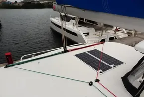 Lagoon 42 catamaran (2020) with solar panel docked at marina.