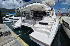 2021 Leopard 45 catamaran docked at marina, showcasing spacious deck and modern design.