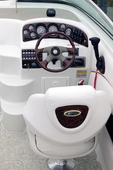 Crownline Cuddy Cabin 235 CCR - A fully equipped helm includes lifetime warrantied instruments with stainless steel bezels, engine hour meter, tilt steering wheel, adjustable Tri-Tech bucket seat and woodgrain dash and wheel insert