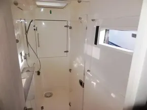 2017 Leopard 43 Powercat shower cabin with modern fixtures and natural light.